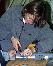 Chemist Karen Von Damm sets the trigger that ROV Jason will pull to close the water sampling bottles. 