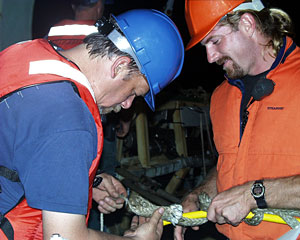 Chief Pilot Will Sellers and Chief Mate Kent Sheasley tie “Chinese fingers” on the Medea-Jason tether before last night’s launch. This type of knot helps to relieve the strain on the fiber optic cable when Jason is recovered.
