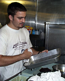  Mess Attendant Geryk Paige keeps things shining in the galley.  
