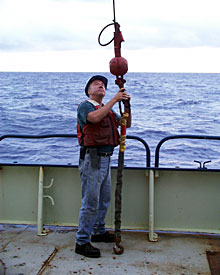 Bosun Al Hopkins directs crane operations before bringing the elevator on to the ship.  
