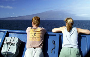 Dennis Geist and Karen Harpp at Revelle’s bow rail as Cerro Azul passes by this afternoon. A large landslide on the western cape of Isabela Island can be seen between their heads. We hope to see evidence of the submarine portion of this landslide in our MR1 sonar records.