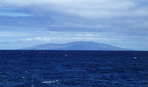 Pinta Island rises in the distance, as we passed on the way to Genovesa Island for our survey of its submarine east rift zone.  