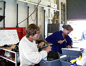  Bob Reynolds and Karen Harpp chip glass from rocks that were recovered in the rock dredge this morning.  