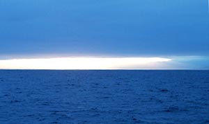 Another beautiful sunrise breaks the horizon just as dredge #24 comes on board. 