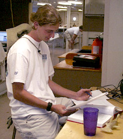 Schoolwork continues, even on board. Ben Grosser does his geochemistry homework. 