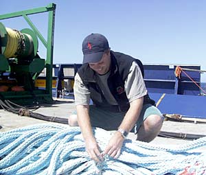 Paul Johnson ties up the MR1 drogue line for storage in the vans.  