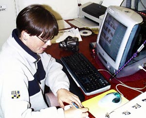  Rhian Waller prepares the daily slideshow pictures for the Dive and Discover site. 