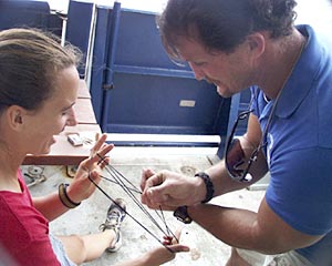  Lorna Allison, Ordinary Seaman, teaches Jim Pearson, Able Seaman, to play Cat’s Cradle in their spare time. 