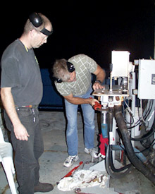 Tim McDaniel, Oiler, and Steve St. Martin, 2nd Assistant Engineer, work to fix a hydraulic leak on the A-frame.  