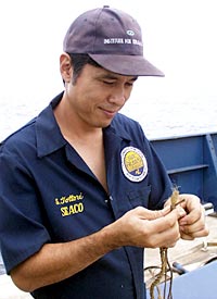 Steve Tottori secures the line ends for the MR1 sidescan-sonar, and prepare it for being packed away so that it can travel to Korea, where it will be used for its next survey operation  