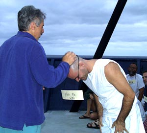 All the Pollywogs were given their names to be used for the day. Here “Mini-me” (Steve Volpe) gets his name tag to wear all day. 