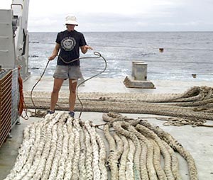  Lorna Allison, Ordinary Seaman, prepares one of the docking lines on the fan tail. 