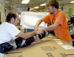  Joe Licciardi and Jeremy Haney pack away the sonar maps in the main lab.  