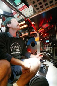 Alvin pilot BLee Williams checks all of Alvin’s electrical and hydraulic systems while the submersible is still at the surface and before it dives.