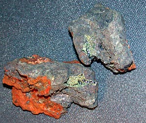  Samples of the sulfide chimneys collected today during Dive 3795. The gold, shiny sections represent the linings of channels where hot water flowed . 