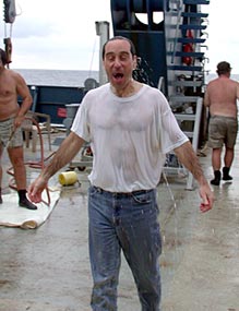  Rookie diver Lonny Lippsett endures the traditional soaking in ice water after his first dive in Alvin today. 