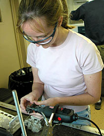 Scientist Selene Eltgroth doing some of the necessary dirty work, cleaning corals retrieved from the Manning seamount. Scientists work in shifts on board, in order to clean corals and prepare data for further research on land once the cruise is finished.