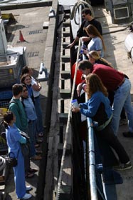 Friends from the University of Washington line up on the dock bidding farewell to fellow graduate students sailing to the Juan de Fuca Ridge onboard Atlantis. 