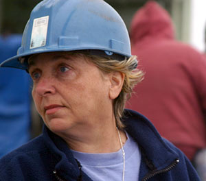 First mate Mitzi Crane observes the departure of Alvin. Her jobs on Atlantis include commanding the vessel eight hours a day, safety training, deck maintenance, and shared responsibilities for medical response if someone is injured.