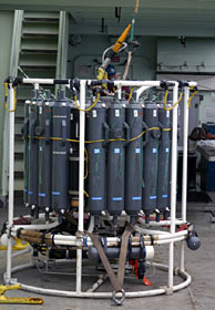 Since Alvin dives occupy ship and crew time during the day, researchers work at night to prepare for the next morning’s dive. Several graduate students were up all night preparing this 9-foot-tall instrument, called a CTD, which measures conductivity (to determine salinity of the water), temperature, and depth. It is a workhorse for many oceanographers.