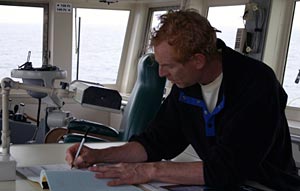 Second Mate Craig Dickson in the Atlantis bridge. Craig spends six months each year at sea, and has worked for the Woods Hole Oceanographic Institution for 23 years. He grew up on Cape Cod, and started sailing and working on fishing boats in his early 20s.