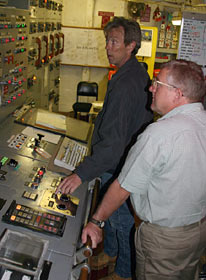 Seaman Raul Martinez keeps watch from the bridge, a top area of the ship where the captain and mates steer and direct the vessel’s position.