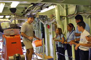 Alvin pilot Anthony Tarantino gives six students from two Costa Rican junior high schools a tour of the submersible Alvin, They also toured the ship during their visit the afternoon before our departure. Their two-hour visit was part of a marine life and technology program at their schools.