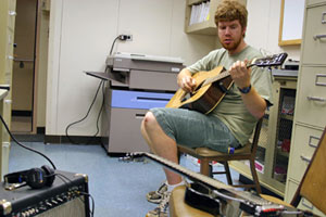 “I’m really a banjo player,” third mate Jacob Fleming said “but I’m thinking of picking up the guitar.” Jacob and several other musical crew members can be found playing after completing their ship duties. (Photo by Amy Nevala)