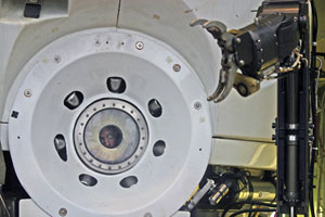Alvin pilot Gavin Eppard peers from the viewport as he checks the movement of one of the submersible’s manipulator arms, part of the pre-dive check of all sub systems.