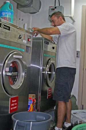 3. Alvin pilot in training Anthony Berry finishes his final load of laundry before the ship docks in Costa Rica. (Photo by Amy Nevala)