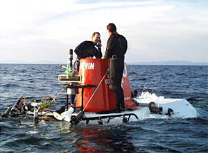 The swimmers use the sound powered telephone to talk to the pilot to tell him that all the valves and emergency lights are OK and that Alvin is ready to dive.
