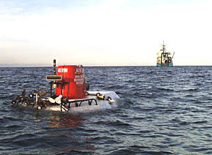 Alvin starts its descent with R/V Atlantis in the background. 