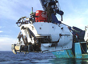 Alvin is lowered on a thick Kevlar rope into the water. 
